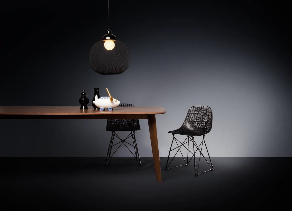 Poetic composition Zio Dining Table, Non Random suspension light and Carbon Chair