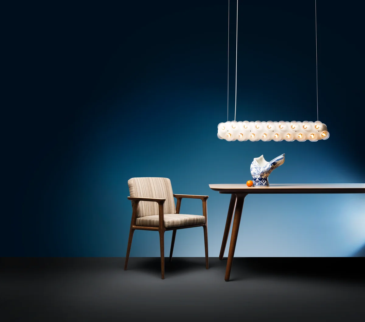 Poetic composition Zio Dining Chair, Zio Dining Table, Blow Away Vase and Prop Light suspension